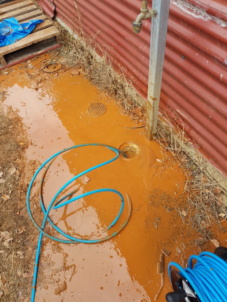 Pier footing drilled through the sewer — Drain Masters Plumbing