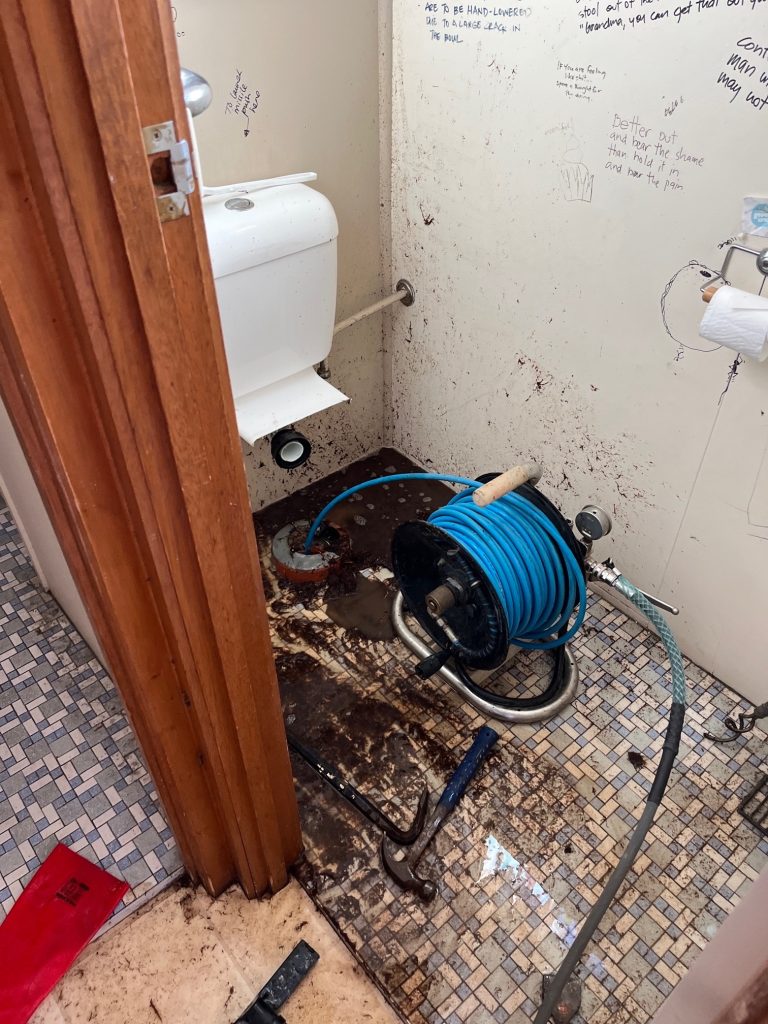 Isolated toilet blockage, old concreted pan — Drain Masters Plumbing