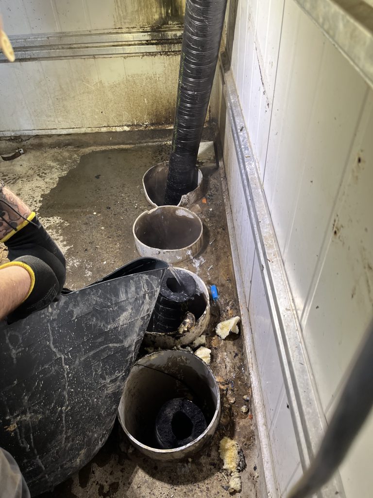 Vacuum excavation at a Brisbane pub during a beer-line replacement, clearing conduits with hydrojet and disinfectant.