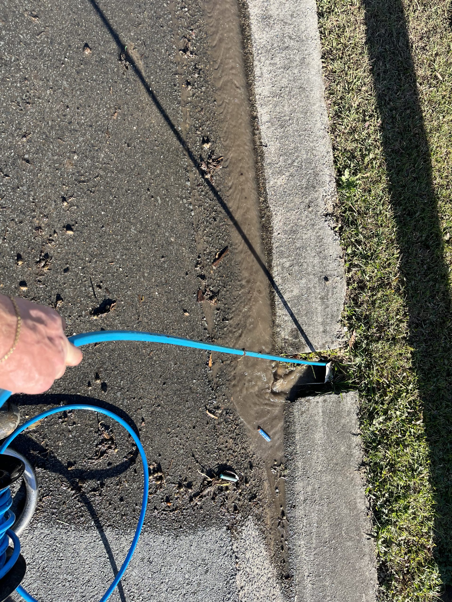 CCTV drain camera monitor confirming a Robina drain line is clear after hydrojet silt removal.